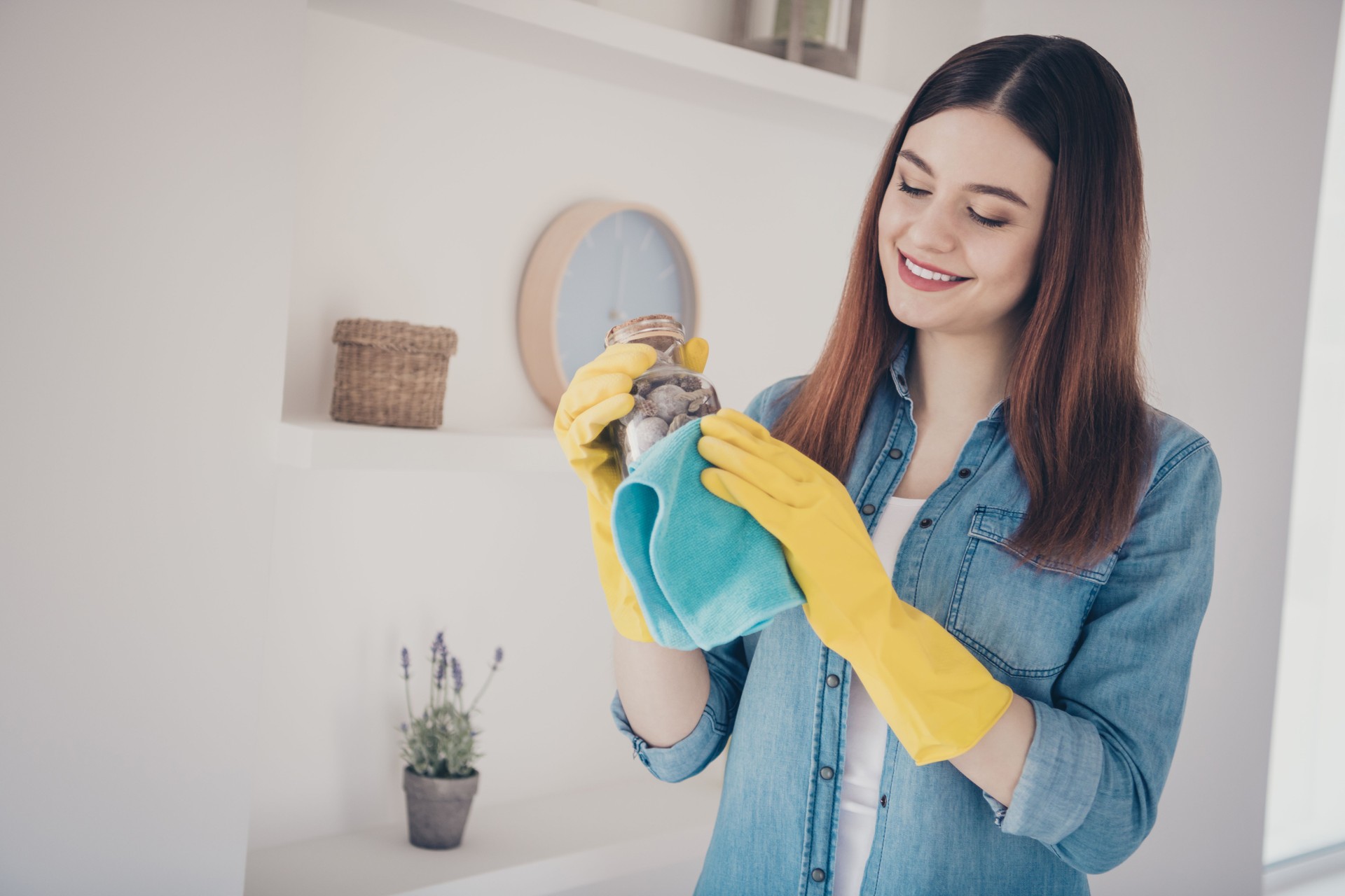 Photo of pretty housemaid make general spring cleaning dusty sea bottle living room